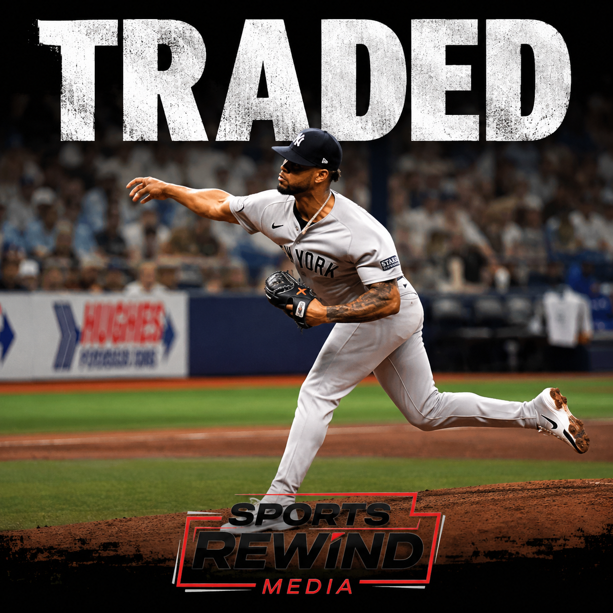 Baseball pitcher in a gray Yankees uniform delivering a pitch on the mound; oversized 'TRADED' text dominates the top.