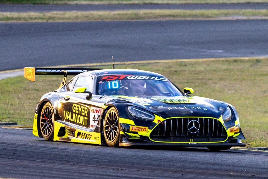 _I1A1608 • Sports Rewind Media Race car on track, Mercedes AMG GT3 with neon-yellow livery, number 44, sponsor decals including GEYER VALMONT, speeding on curve on asphalt track