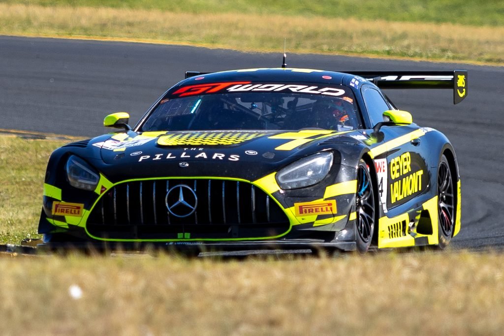 _I1A2380 • Sports Rewind Media Black and yellow Mercedes race car on a track, front grille with Mercedes emblem and Pillars branding visible.
